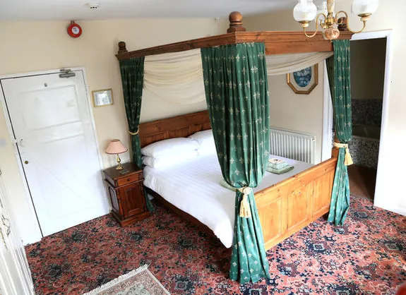 A four-poster bedroom at The Kildare Lodge Hotel