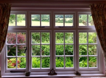 View of the garden through the cottage window