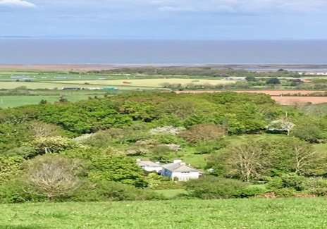 View across fields towards the coast