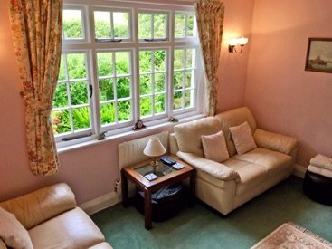 Armchairs beside the cottage window